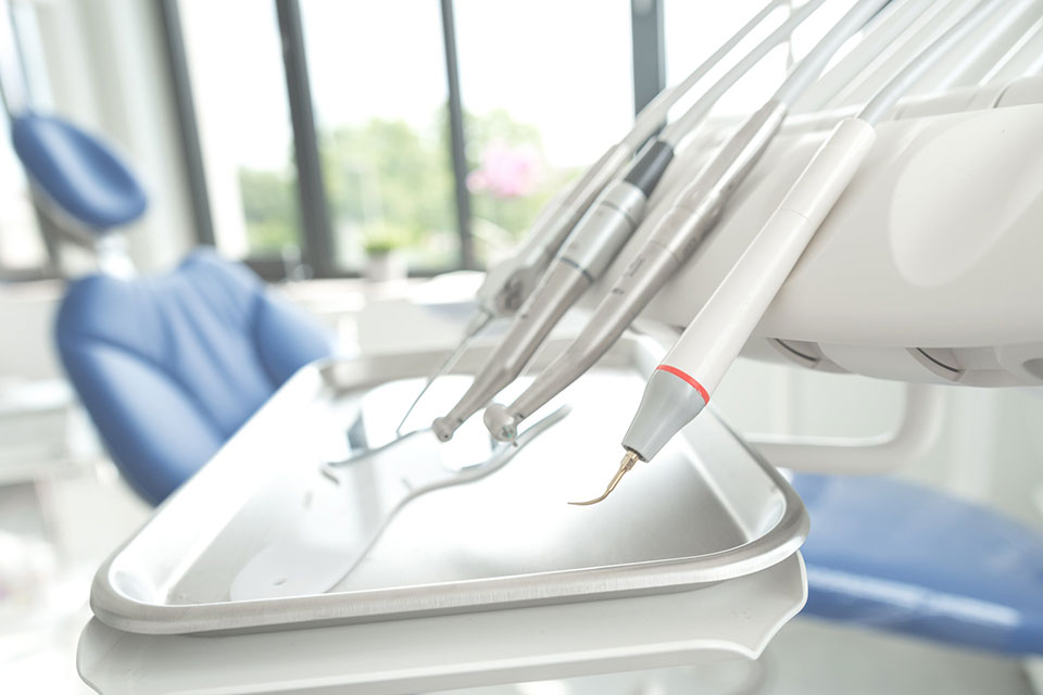 Dental tools and chair in clean office