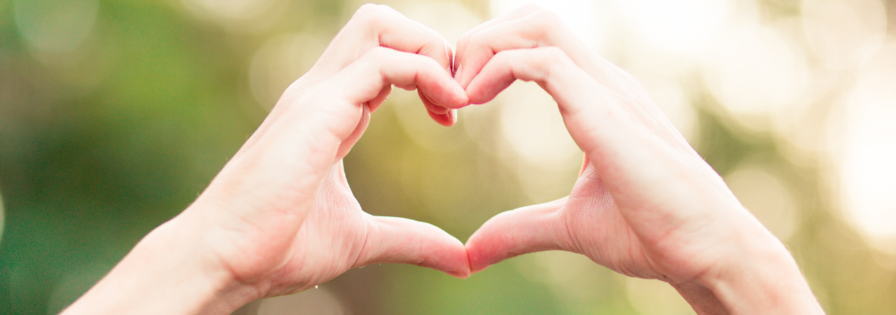 pair of hands forming a heart