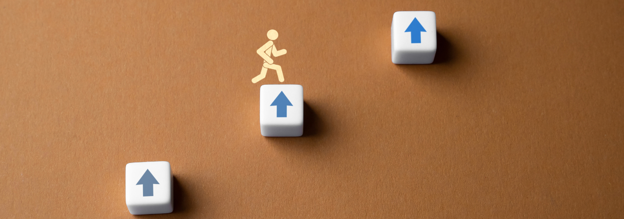 A figure climbing up three blocks with up arrows on them