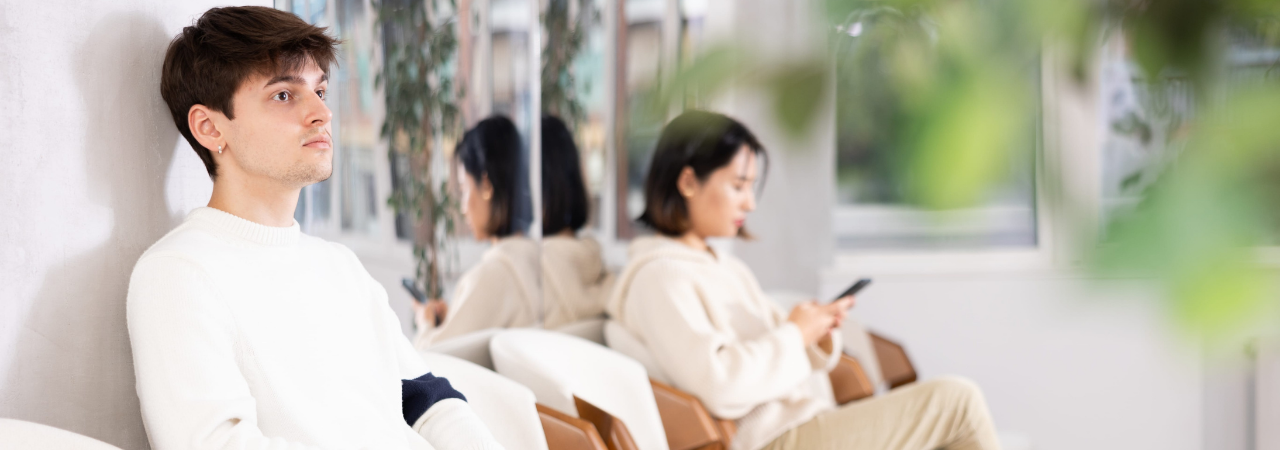 Male teenage patient waiting anxiously for their dental appointment