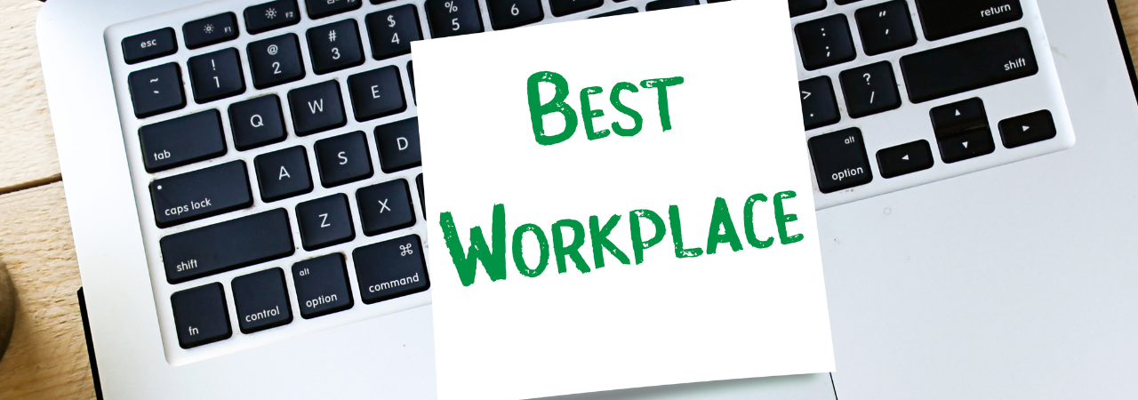 sticky note reading "best workplace" on a laptop