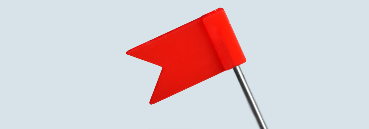 red flag against a gray-blue background