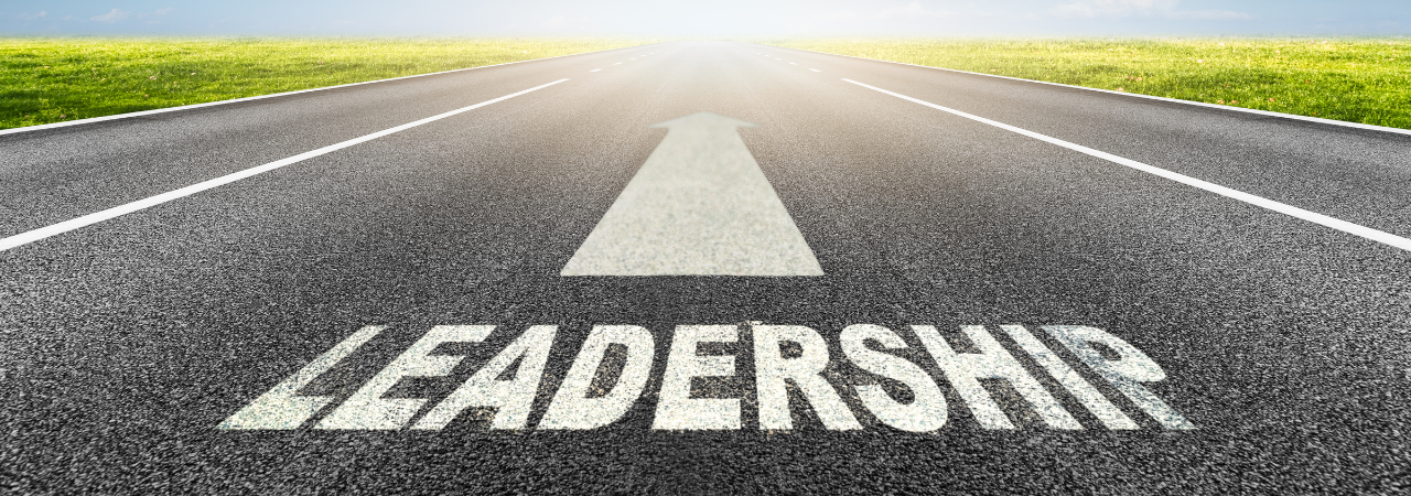 road with the word "leadership" and an arrow pointing straight ahead