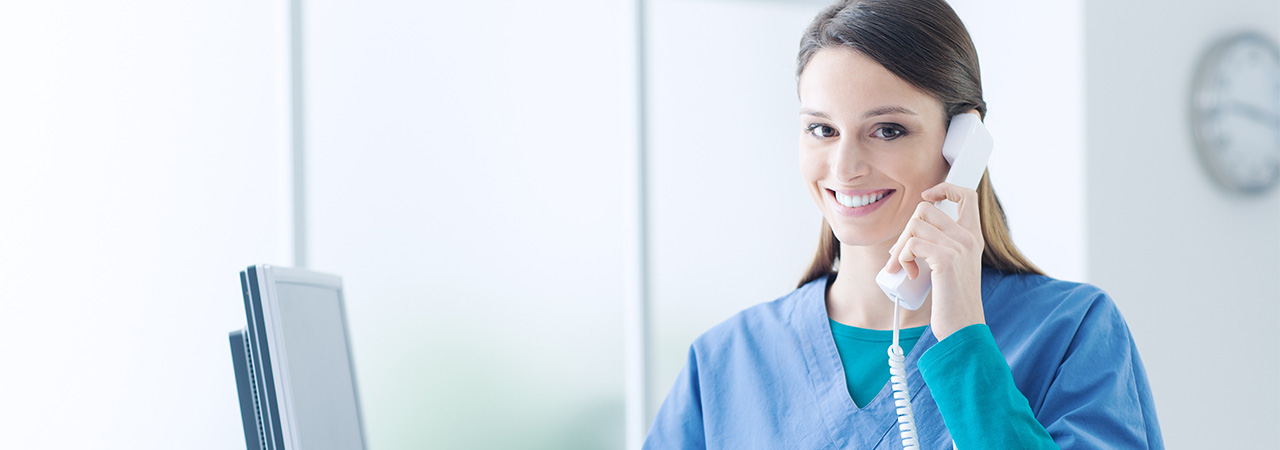 dental assistant talks on the phone