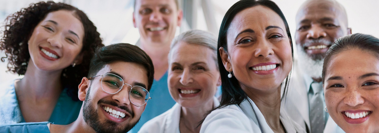 A dental team smiling in a selfie