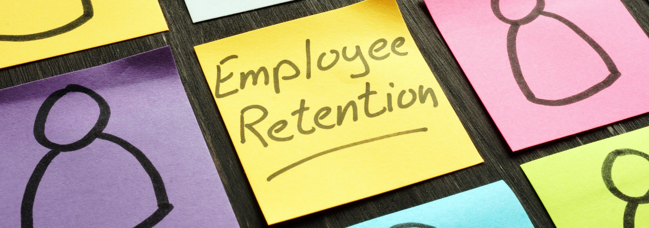 post-it note that reads "employee retention"