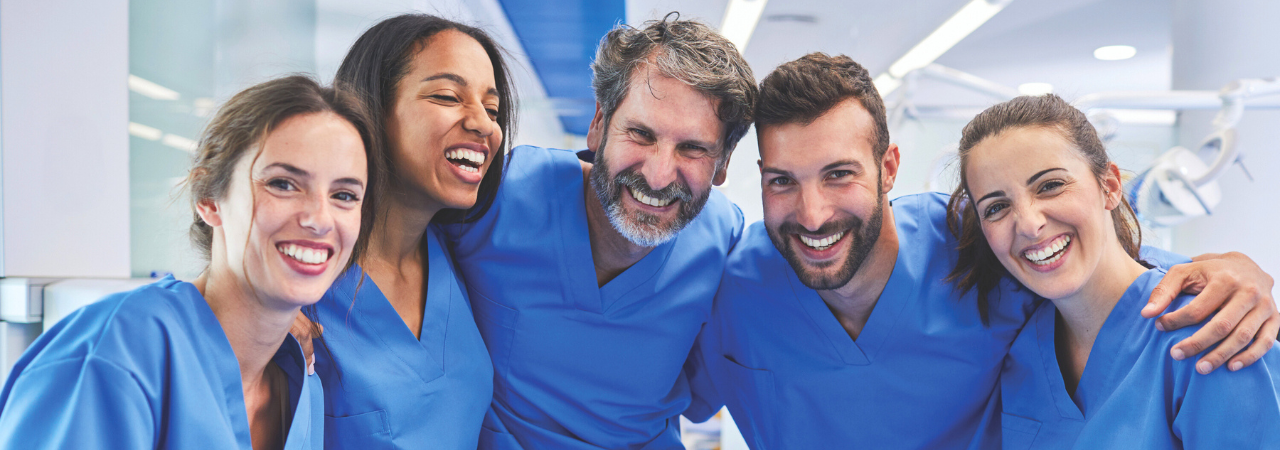 Group of smiling dental assistants of various ages