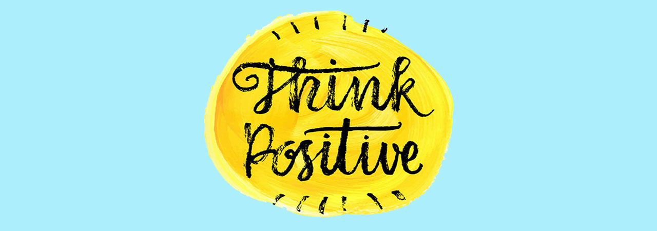 think positive message in script on yellow and blue background