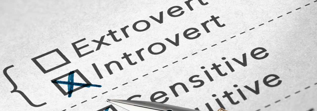 Checked "Introvert" box on a personality questionnaire with a pen nearby.