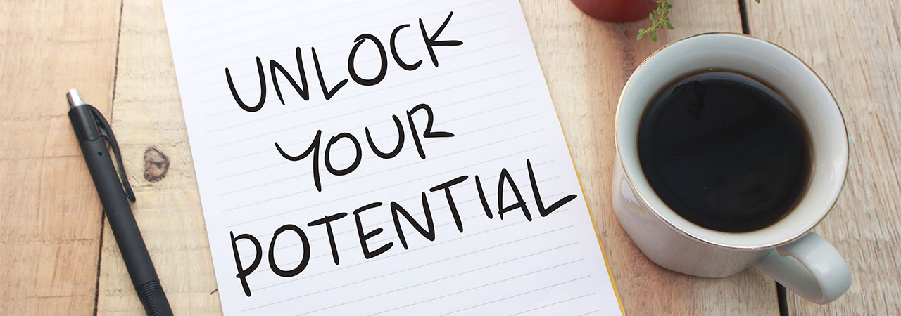 pad of paper that reads "unlock your potential"