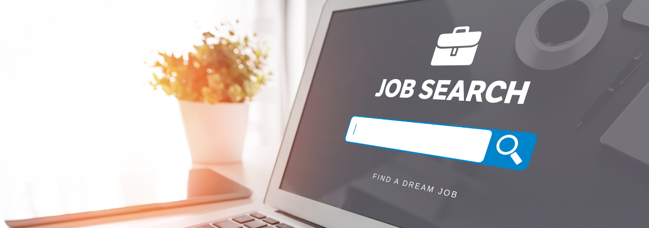 laptop sitting on a desk with a job search website on the page