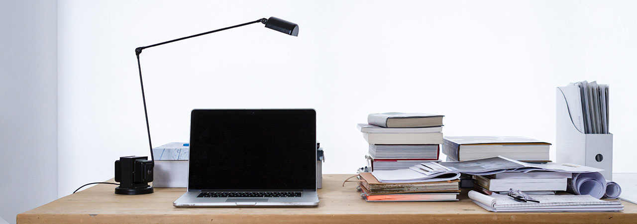 desktop with computer and books