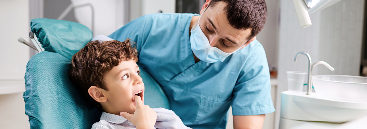 dental assistant talking to a pediatric patient