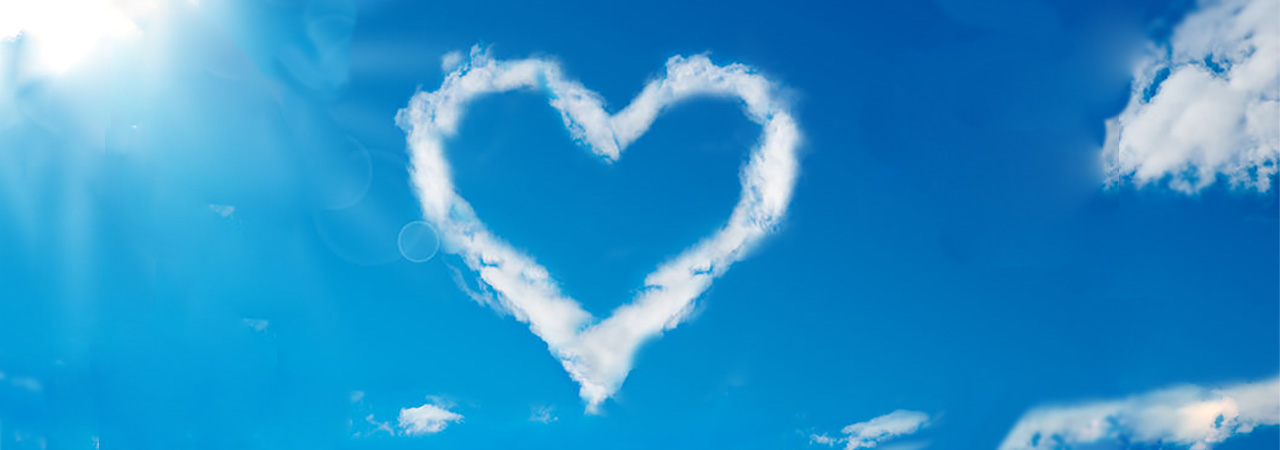 heart cloud shape in bright blue sky