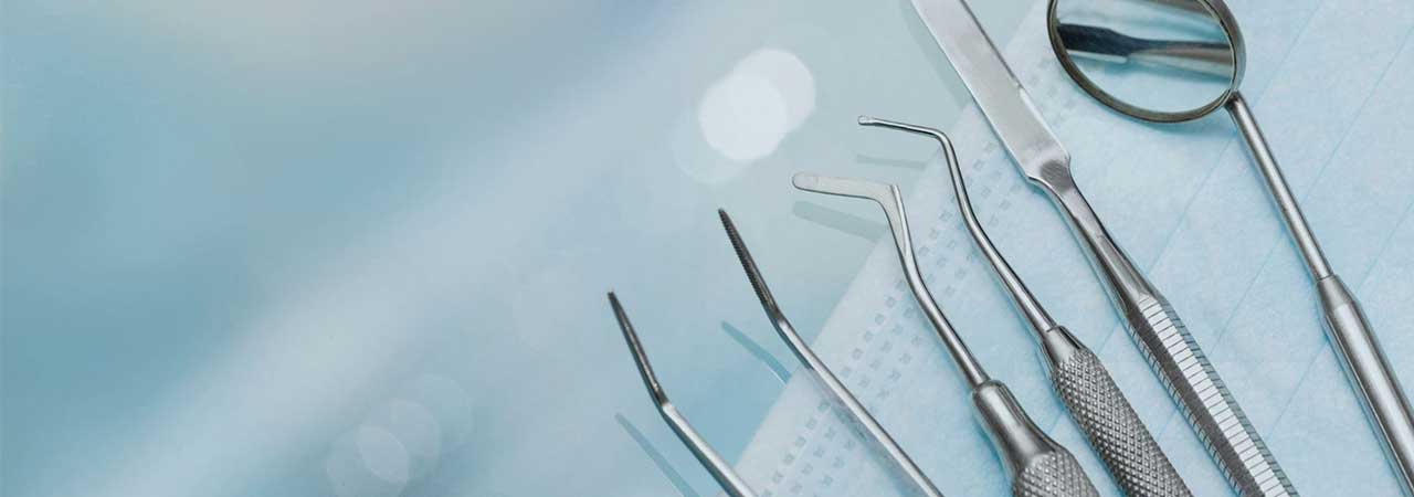 Close up of dental tools on blue background
