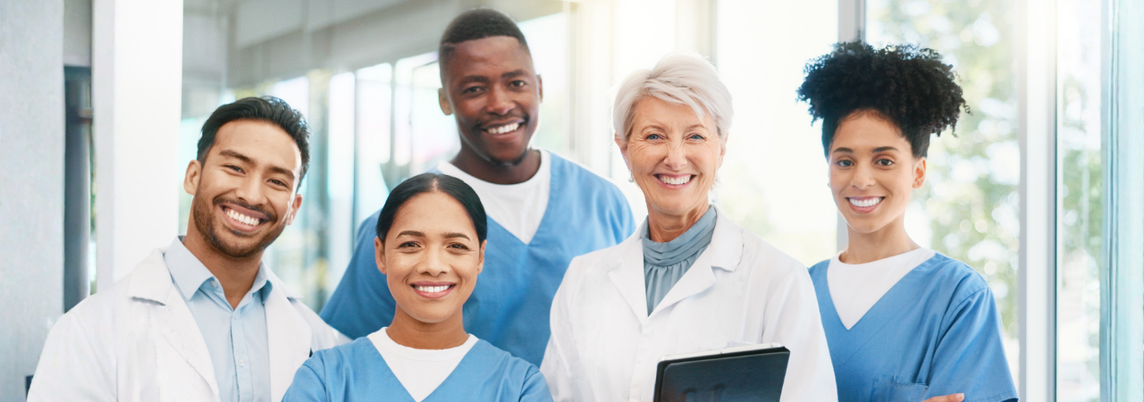 Smiling dental team of dentists and assistants