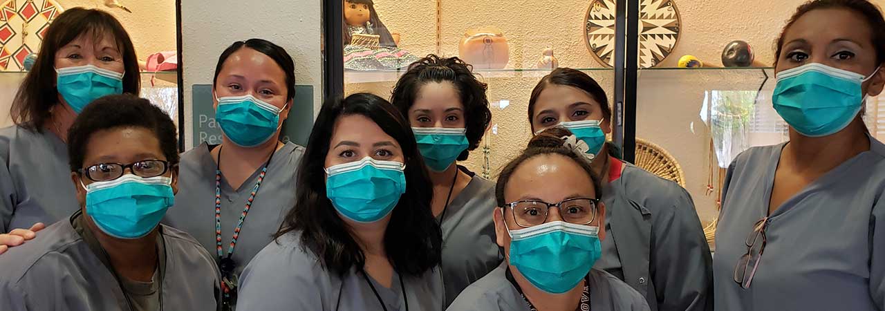 Doreen Denisty and staff wearing masks