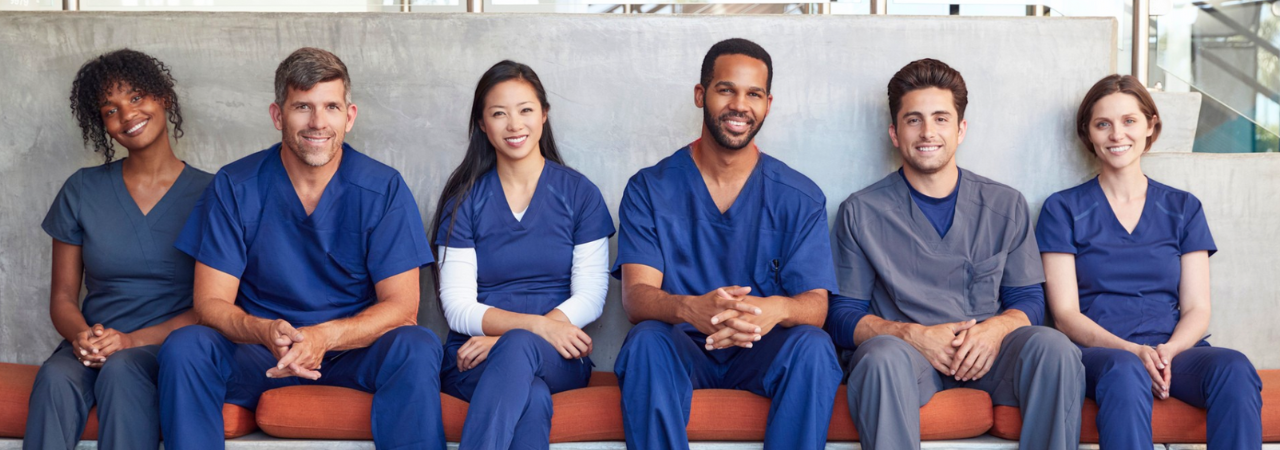 smiling dental assistants seated