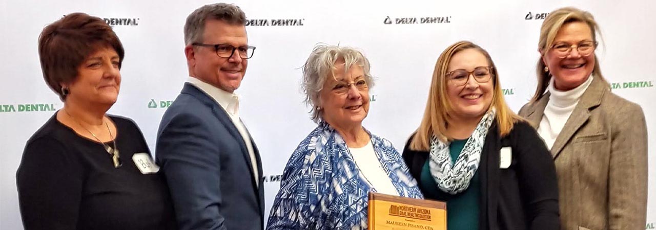 Maureen Pisano accepts her Oral Health Hero of the Year award